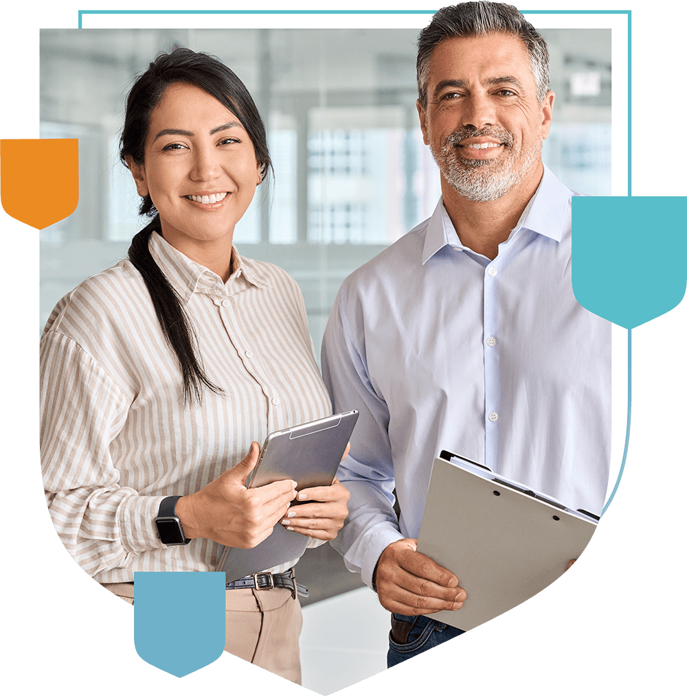 A man and woman holding a folder and smiling