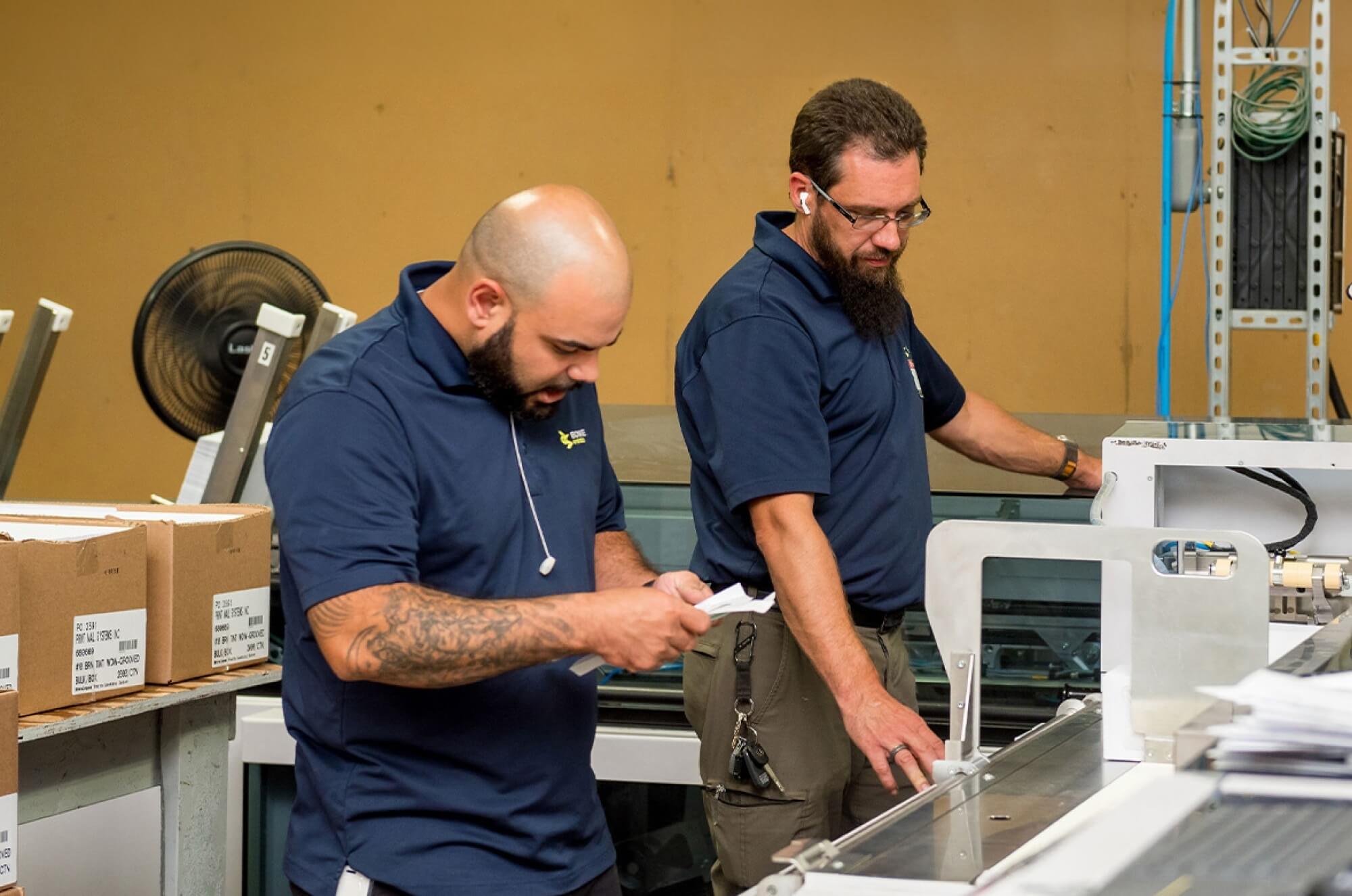 two people working in a factory