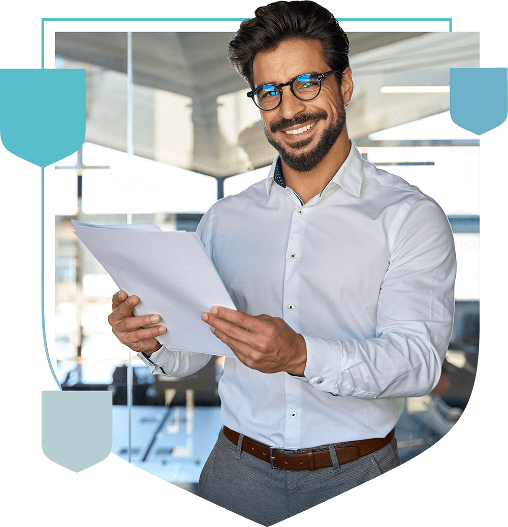 smiling man holding documents