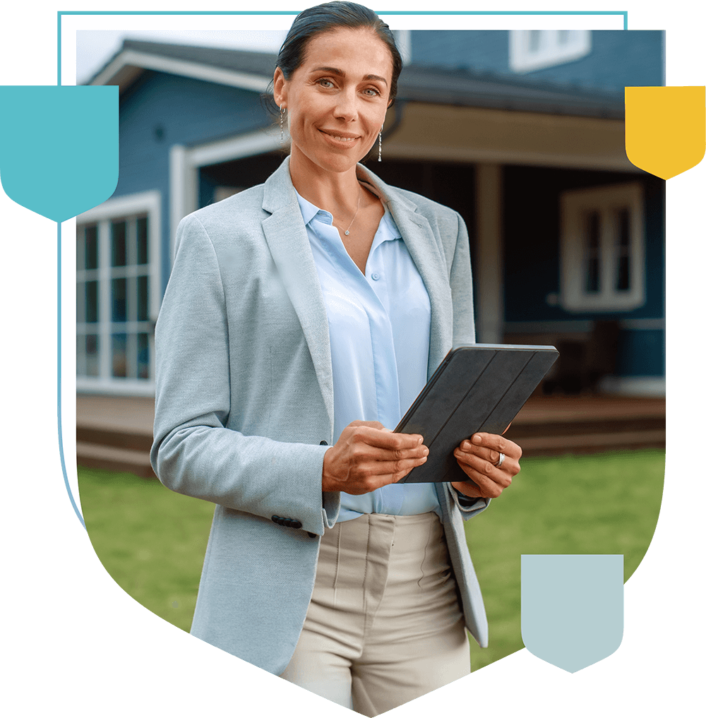 woman in front of a house holding a tablet