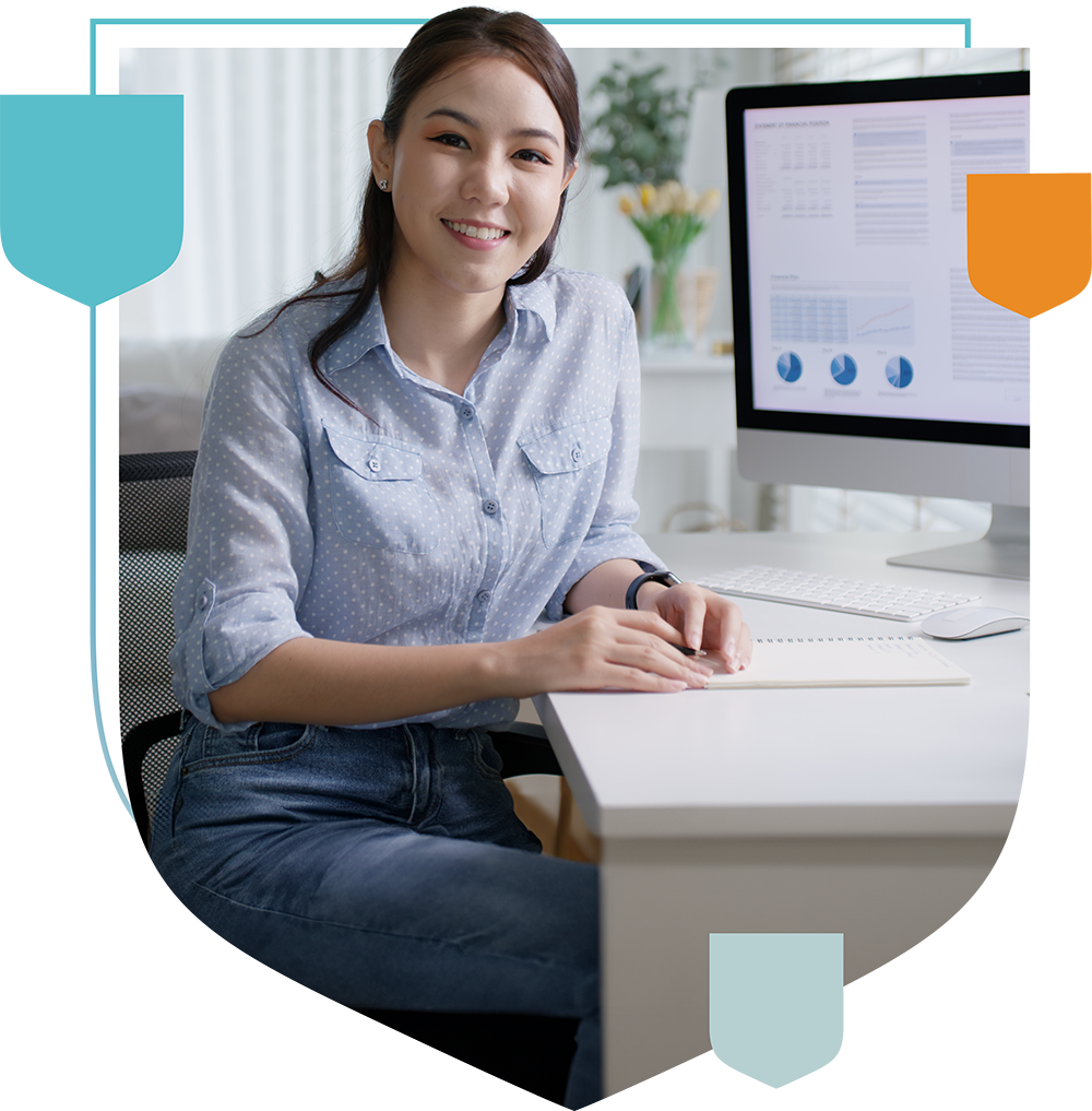 a woman with a notebook at a desk