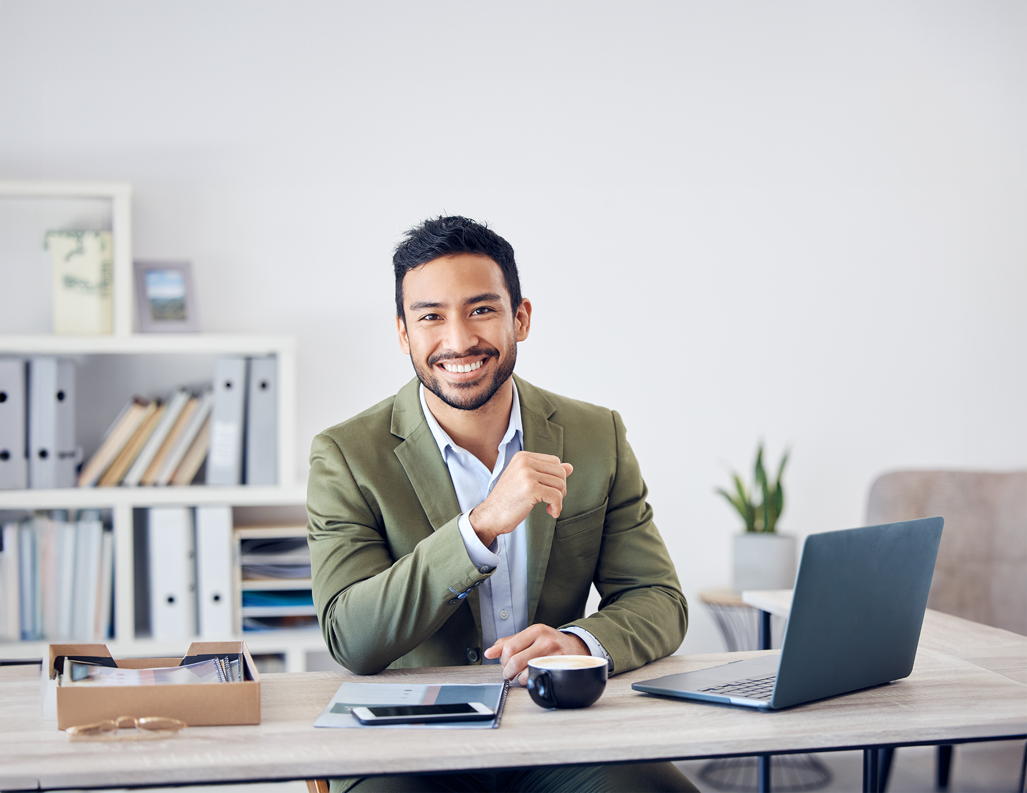 man at desk smiling